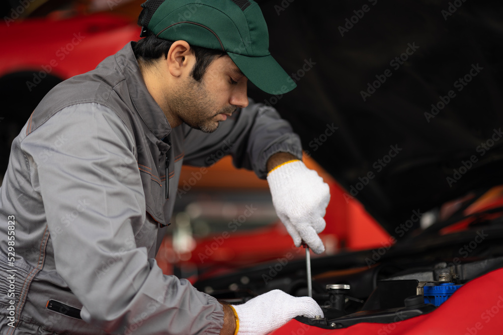 Automobile mechanic man checking car damage broken part condition. diagnostic and repairing vehicle at garage automotive, Concepts of car care check and fixed and services insurance. Automobile mechanic man checking car damage broken part condition. diagnostic and repairing vehicle at garage automotive, Concepts of car care check and fixed and services insurance.