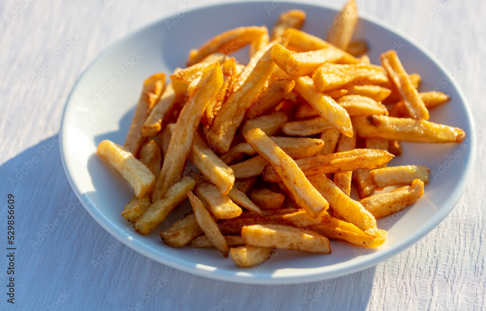 fried french fries on a white plate fried french fries on a white plate