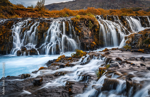 Fantastic Bruarfoss Waterfall. Amazing nature of Iceland. Iceland popular place of travel and touristic location. Wonderful Icelandik landscape during sunset. Creative image. Natural background © jenyateua