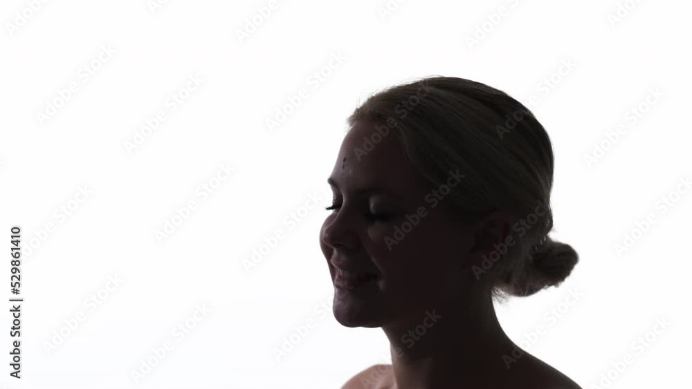 Relaxing vibe. Chill trance. Inner peace. Tranquil inspired smiling woman face dark silhouette isolated on white copy space background. Relaxing vibe. Chill trance. Inner peace. Tranquil inspired smiling woman face dark silhouette isolated on white copy space background.
