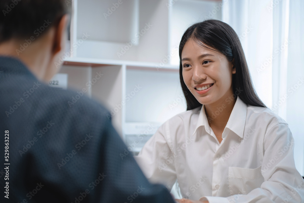 Young woman successful in job interview with resume and documents.. Young woman successful in job interview with resume and documents..