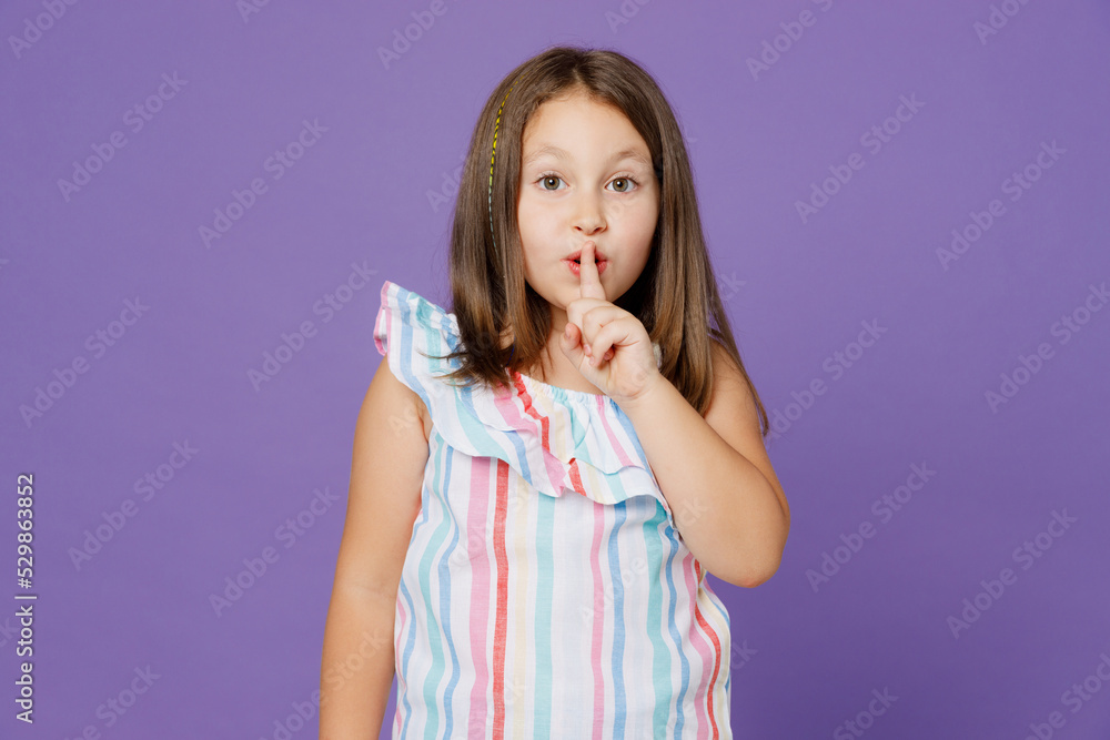 Little secret child kid girl 5-6 year old wears striped dress say hush be quiet finger on lips shhh gesture isolated on plain pastel light purple background Mother's Day love family lifestyle concept Little secret child kid girl 5-6 year old wears striped dress say hush be quiet finger on lips shhh gesture isolated on plain pastel light purple background Mother's Day love family lifestyle concept