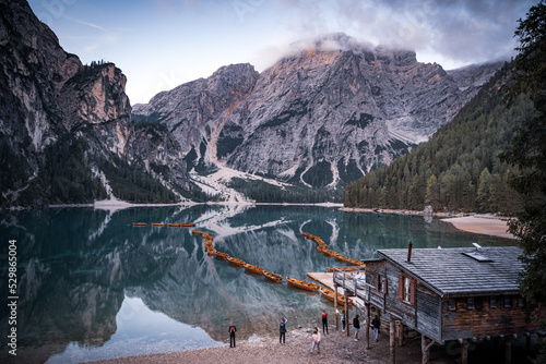 Boats on the Braies Lake Pragser Wildsee in Dolomites mountains, Sudtirol, Italy