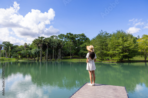 Tourist woman stand on the wooden bridge