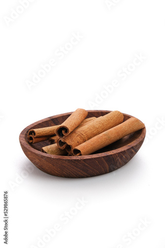 cinnamon sticks on a wooden spoon