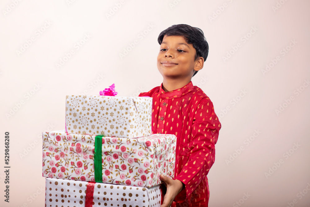 Boy holding a gift on Diwali Boy holding a gift on Diwali