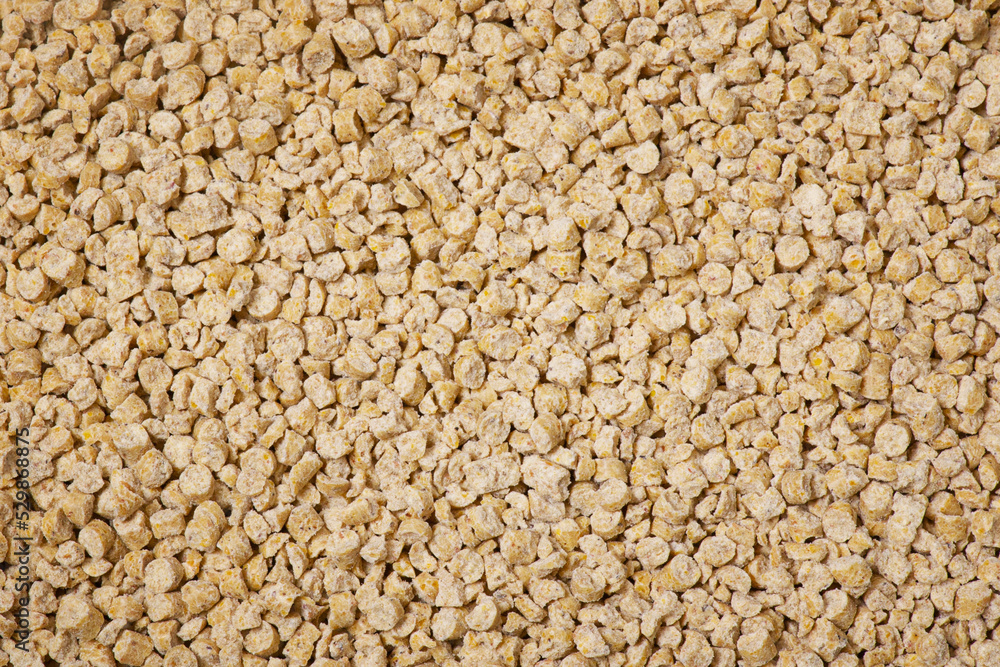 Ecological filler for the toilet of cats and rabbits. Corn filler hygienic for animals background. Ecological filler for the toilet of cats and rabbits. Corn filler hygienic for animals background.