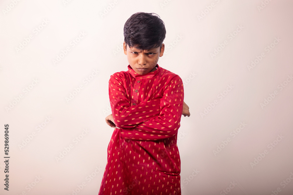 Boy wearing a traditional dress and Angry face Boy wearing a traditional dress and Angry face