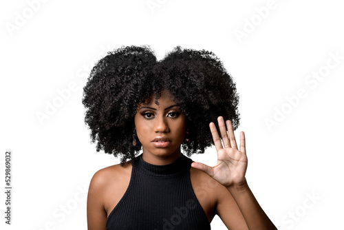 black woman makes gesture with open hand, denounces assault, moral harassment, cowardice, violence against women photo
