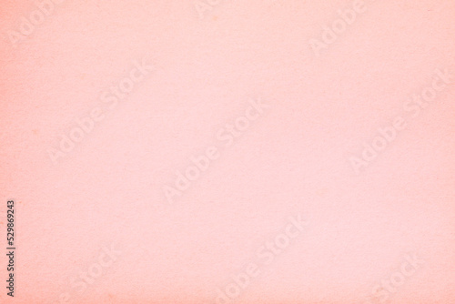 Old vintage pink paper surface texture close up 