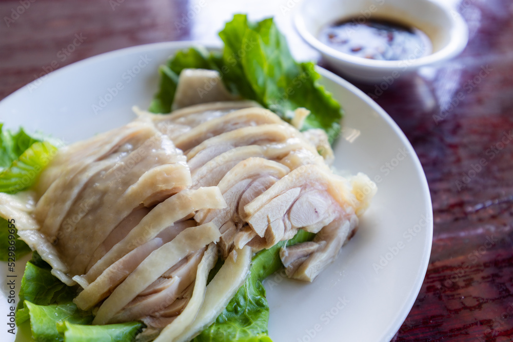 Slice of steamed chicken on plate Slice of steamed chicken on plate