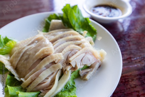 Slice of steamed chicken on plate