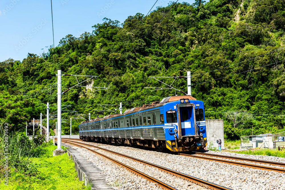 Naklejka premium The train through the beautiful countryside of Taitung, Taiwan.