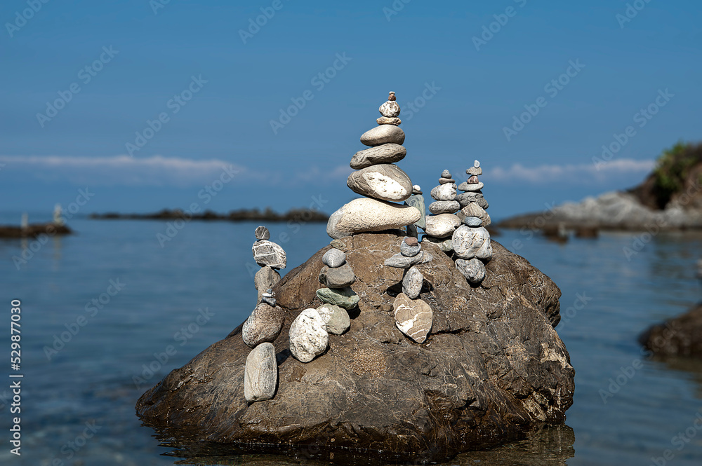 balanced stones on the rocks of the sea
balanced stones on the rocks of the sea