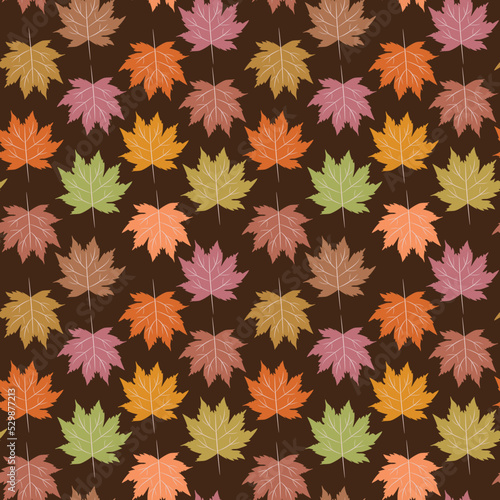 Cute colorful autumn maple leaves in green  orange  brown and coral on black background. For Thanksgiving backgrounds  Textile  fabric and wallpaper 