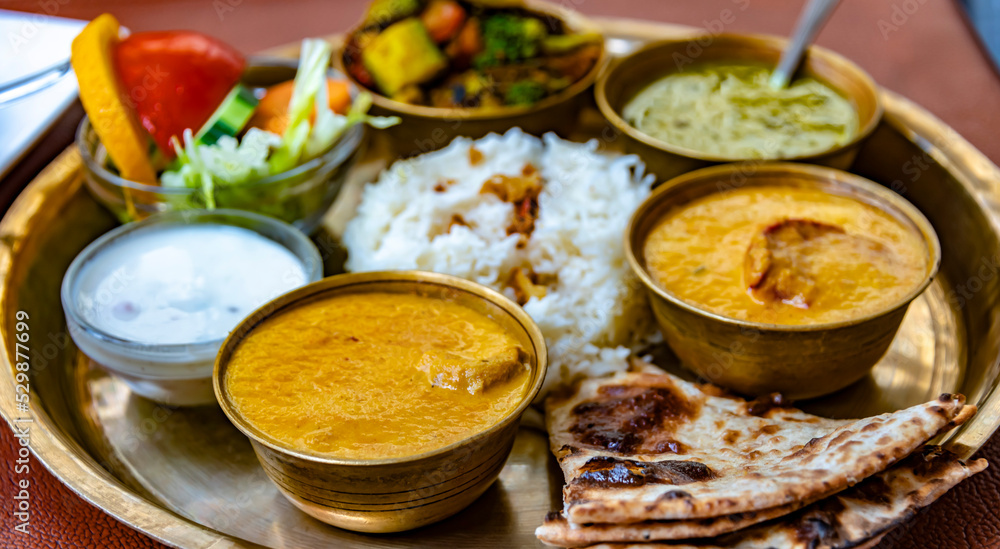 North Indian style vegetarian thali served in a restaurant North Indian style vegetarian thali served in a restaurant