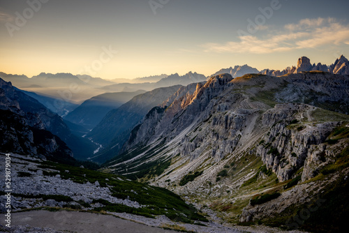 Fototapeta Naklejka Na Ścianę i Meble -  Rifugio Auronzo at sunrise Hiking trail to the Drei Zinnen Hütte in the Dolomites in South Tyrol, Italy.