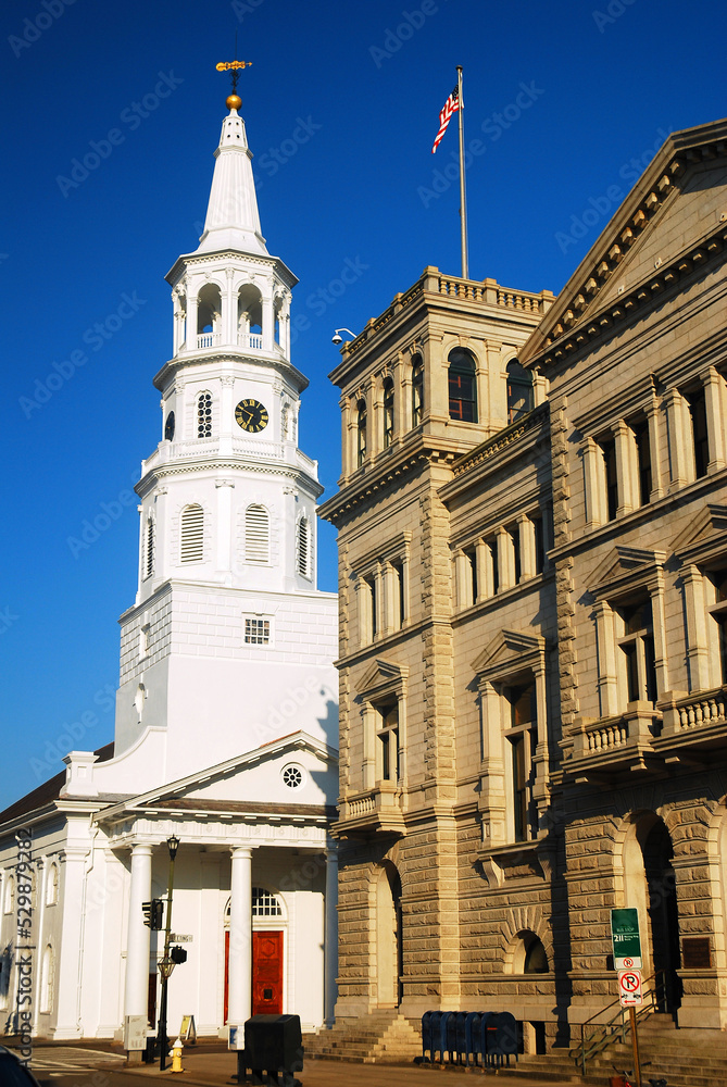 The steeple of St Michaels, in  Charleston, South Carolina rises over the historic buildings of the city