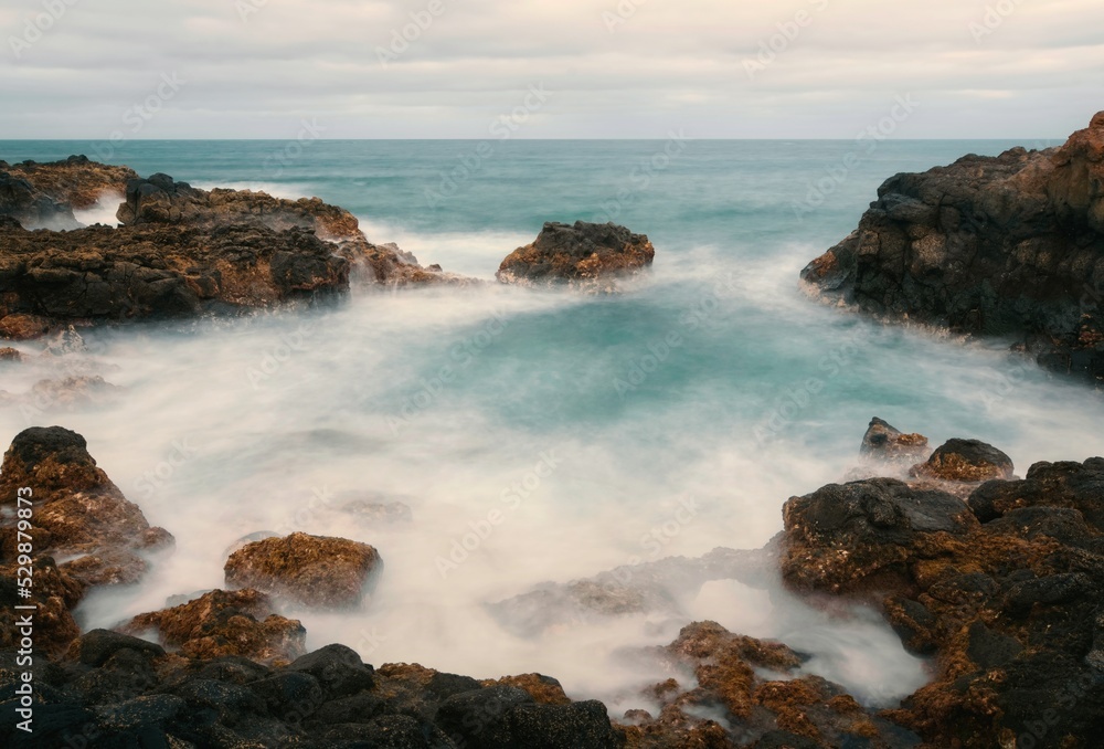 Dramatic volcanic rocky coastal seascape scenery at Charco del Palo, Lanzerote, Canary Islands, Spain 