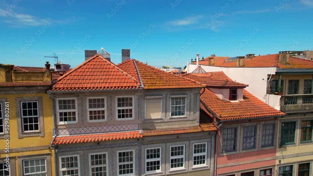 Aerial view of houses with red roofs in the old town in Porto city center at sunny day Aerial view of houses with red roofs in the old town in Porto city center at sunny day