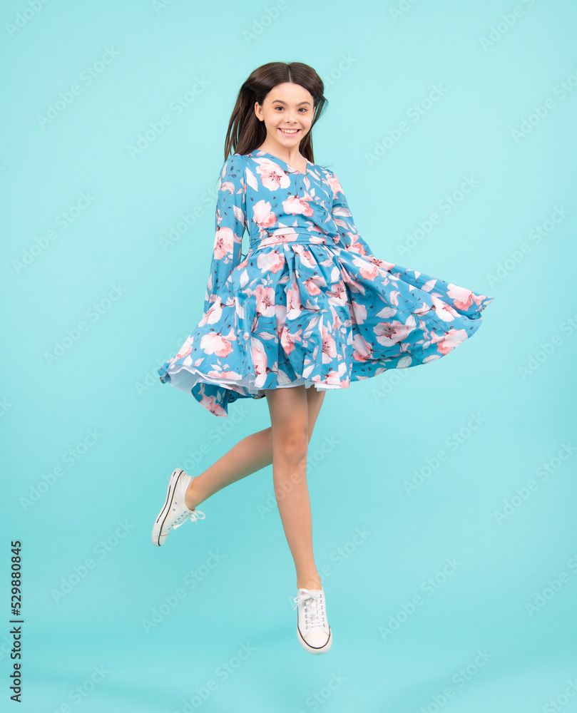 Amazed expression, cheerful and glad. Full length little overjoyed teen girl 12, 13, 14 year old jump and run isolated on blue background studio. Excited teenager, amazed and cheerful emotions. Amazed expression, cheerful and glad. Full length little overjoyed teen girl 12, 13, 14 year old jump and run isolated on blue background studio. Excited teenager, amazed and cheerful emotions.