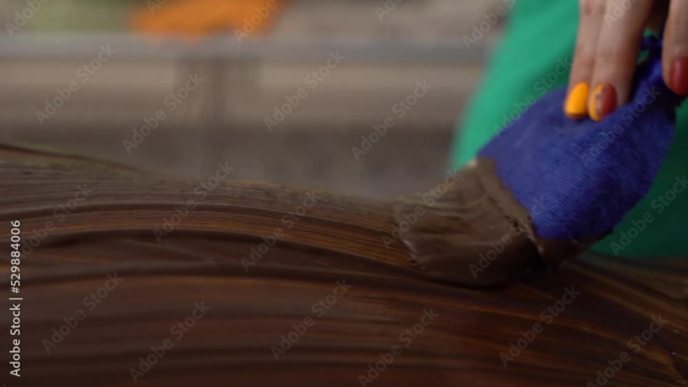 Beautician giving chocolate massage to young man in luxury spa. The masseur rubs chocolate cream into the back and shoulders Beautician giving chocolate massage to young man in luxury spa. The masseur rubs chocolate cream into the back and shoulders