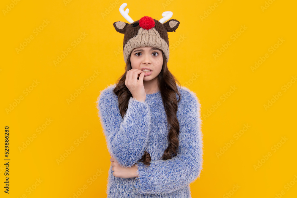 Fashion happy young woman in knitted hat and sweater having fun over colorful blue background Angry teenager girl, upset and unhappy negative emotion. Fashion happy young woman in knitted hat and sweater having fun over colorful blue background Angry teenager girl, upset and unhappy negative emotion.