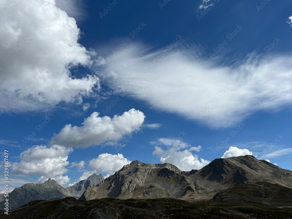 Picturesque and beautiful clouds over the Swiss mountain peaks in the Silvretta Alps and Albula Alps massif, Davos - Canton of Grisons, Switzerland (Kanton Graubünden, Schweiz)