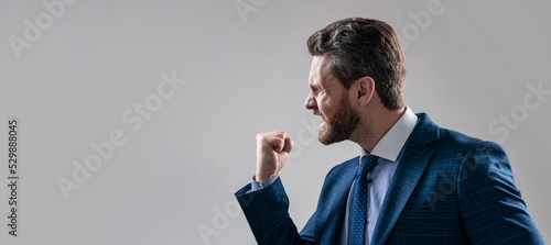 Slika na platnu Aggressive man businessman in suit make threaten gesture shaking fist at somebody, threatening
