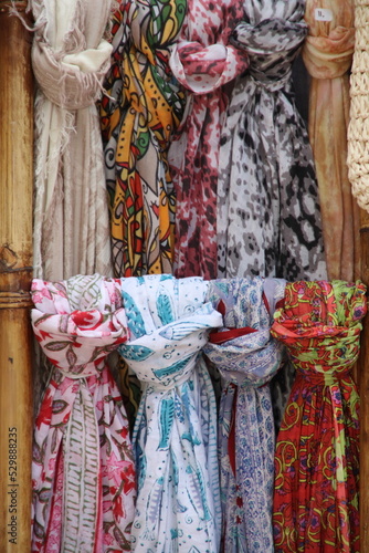 Fashion textile coloured clothes hanging on a boutique