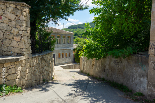 a narrow street on a sunny day
