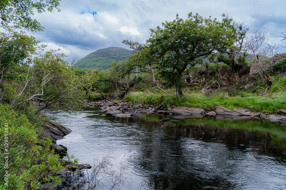 Meeting of the Waters, Killarney. the best hidden gem. This is the point where all of Killarney’s three glorious lakes merge together, the upper lake, Muckross Lake and Lough Leane. Old Weir Bridge. Meeting of the Waters, Killarney. the best hidden gem. This is the point where all of Killarney’s three glorious lakes merge together, the upper lake, Muckross Lake and Lough Leane. Old Weir Bridge.