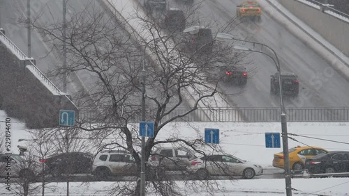Moscow, Russia - 9 January, 2022: View of the Varshavskoye highway. Cars drive along the road on a winter Moscow street