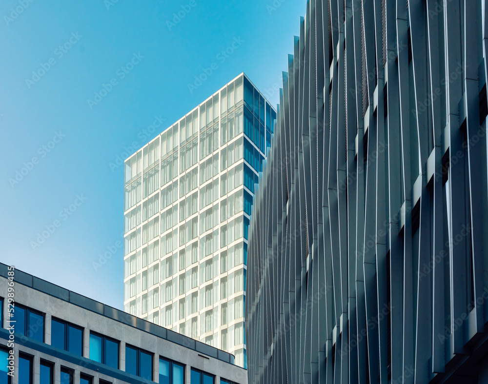 Looking up at modern office buildings in the city center Looking up at modern office buildings in the city center