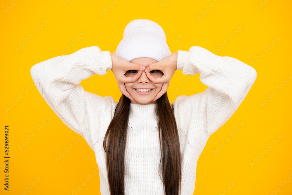Funny face. Teenager child girl look finger specs okey symbol silly shapes figures isolated on yellow background. Funny kids face. Funny face. Teenager child girl look finger specs okey symbol silly shapes figures isolated on yellow background. Funny kids face.