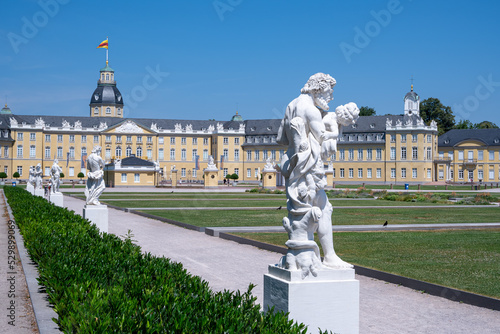 White sculpture on the background of the Karlsruhe Palace and other sculptures, Karlsruhe, Baden-Wuerttemberg, Germany