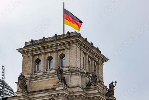 The tower of Reichstag with German flag in German capital Berlin, Germany