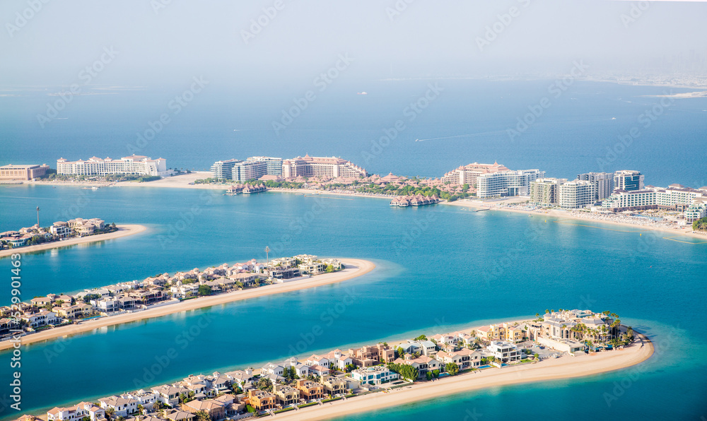 Fototapeta premium The Palm Jumeirah. Holidays villas and luxury hotels view at sunset. Dubai, UAE