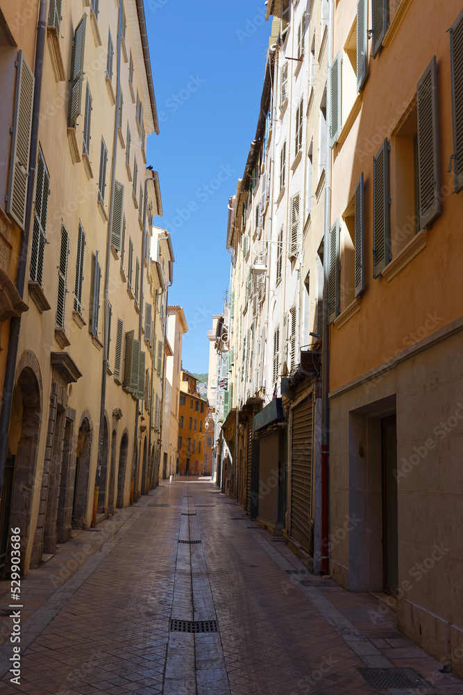 Old Narrow street and apartment buildings in Toulon, Riviera, Cote d'Azur.