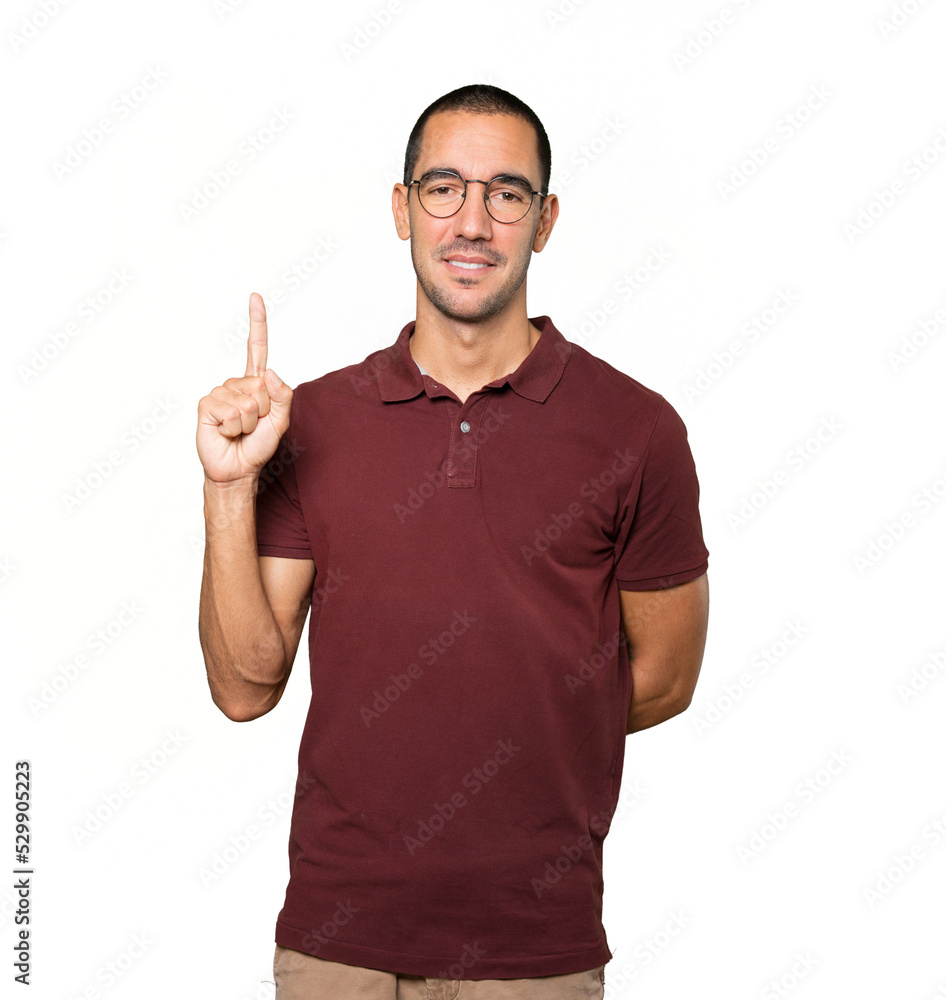 Young man making a number one gesture Young man making a number one gesture