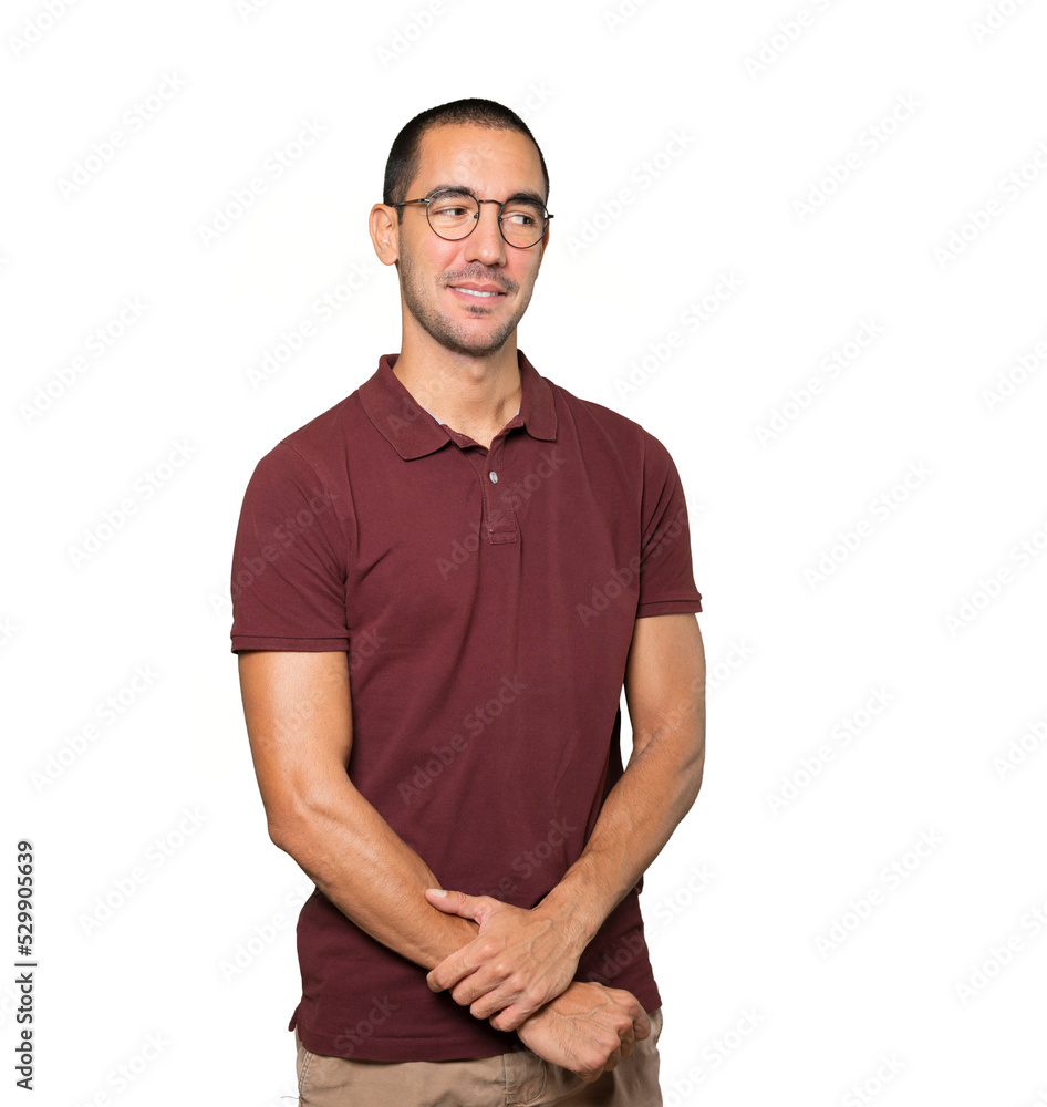 Happy young man posing against background