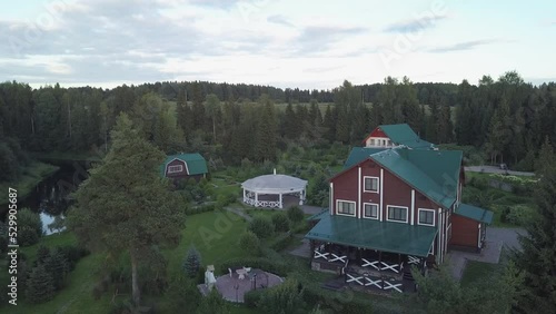 Wallpaper Mural wooden country house in a cottage village on a summer recreation center among green trees. guest house in the rays of the sun. Hunting lodge shooting from a height from a drone. Torontodigital.ca