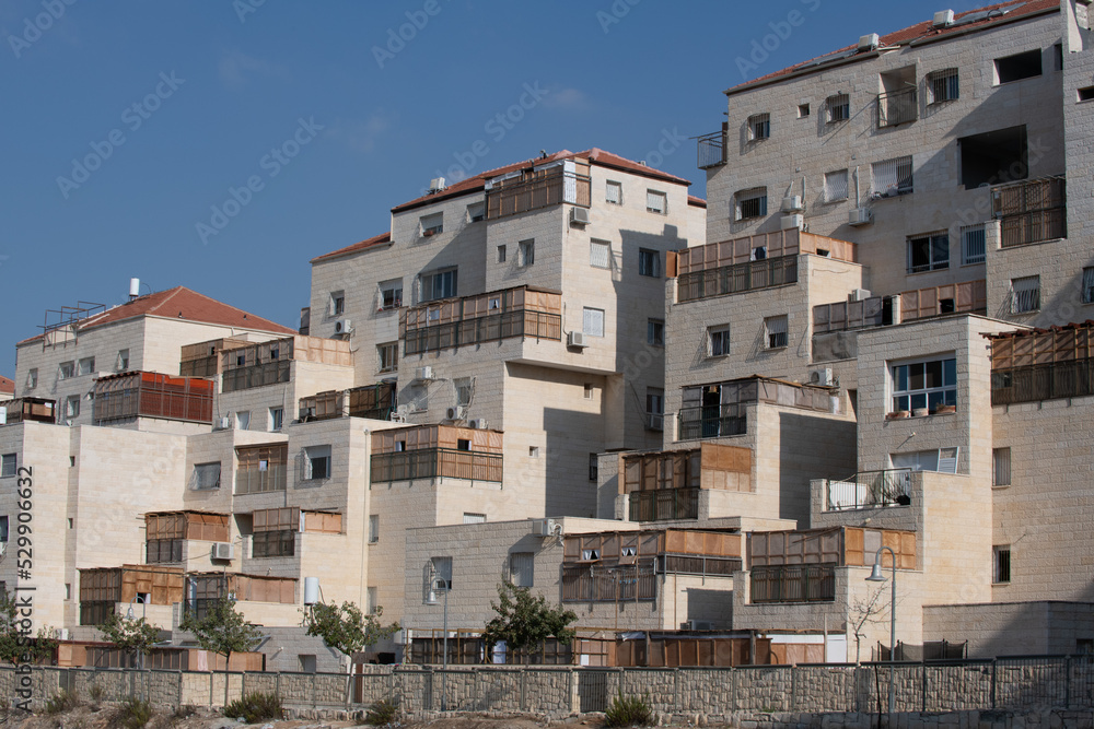 View of a residential apartment complex in Beitar, Israel, during Sukkot, in which temporary, wooden structures are erected on balconies as part of the ritual observance of the weeklong holiday.