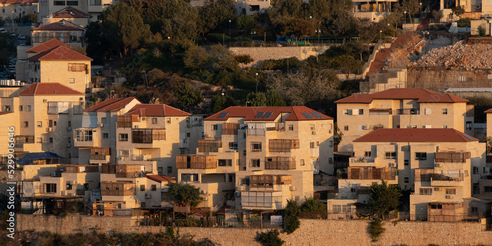 View of a residential building in Israel during Sukkot, in which temporary, wooden structures are placed on balconies as part of the ritual observance of the weeklong holiday.