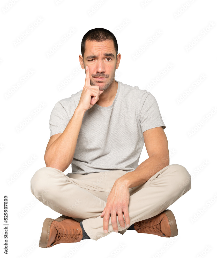 Concerned young man making a gesture of doubt Concerned young man making a gesture of doubt
