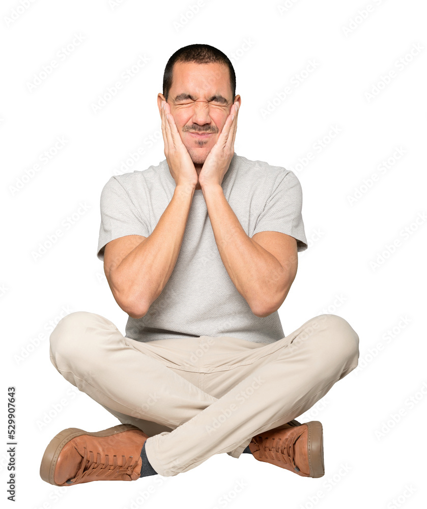 Concerned young man doing a gesture of relief Concerned young man doing a gesture of relief