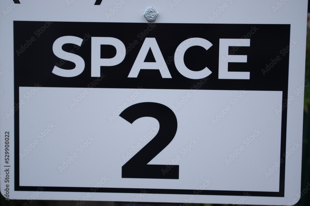 Sign with numbers for parking spots Sign with numbers for parking spots