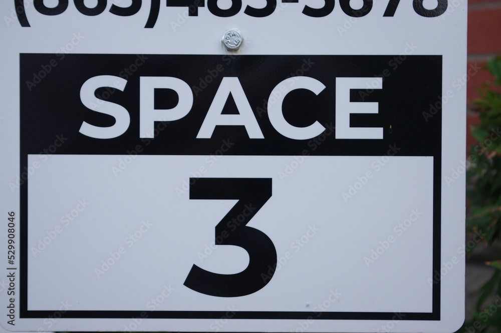 Fototapeta premium Sign with numbers for parking spots