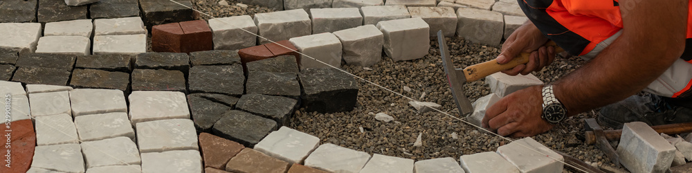 Garden Brick Pathway Paving by Professional Paver Worker. Garden Brick Pathway Paving by Professional Paver Worker.