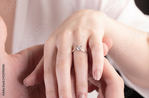 Wedding ring on young woman finger